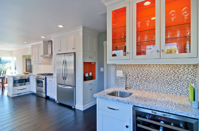 Kitchen cabinet painting by MoonDance Painting — white shaker cabinets with accent interior and mosaic backsplash